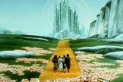 Dorothy and her companions stroll down the Yellow Brick Road toward Emerald City.