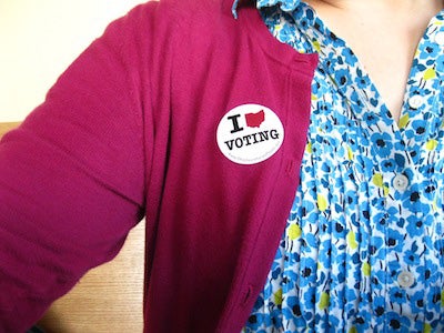 Person wearing an I Heart Voting sticker