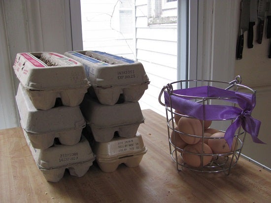 6 cartons of eggs stacked on a table