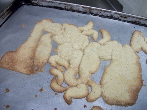 Strangely shaped cookie on a baking sheet
