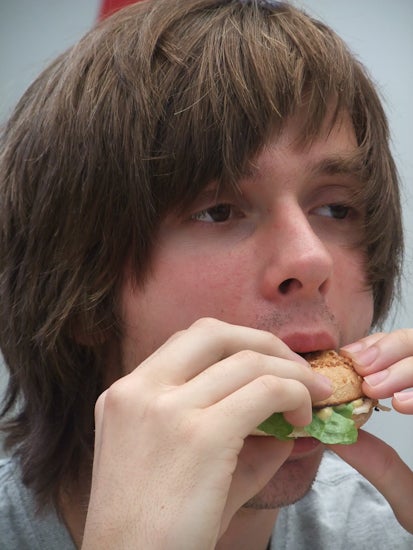 A student eats a bagel