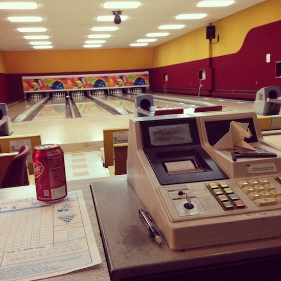 A view of the five lane bowling alley from behind the cash register