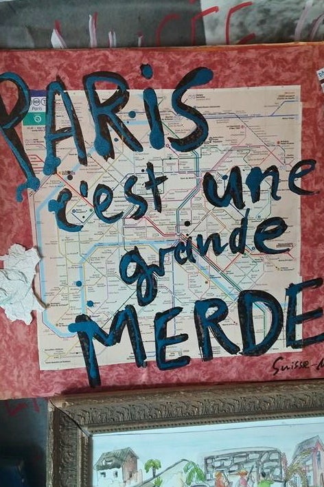 Written over a Paris metro map: Paris, c'est une grande MERDE.