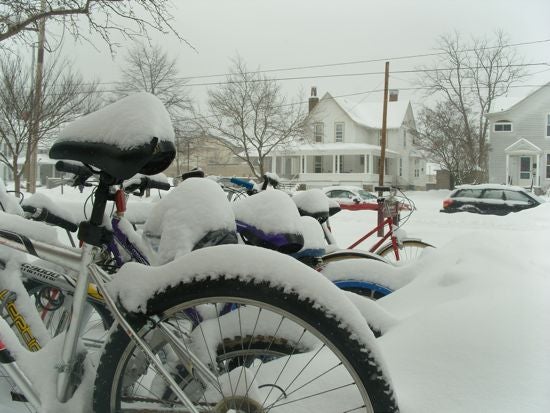 Bikes covered in snow 