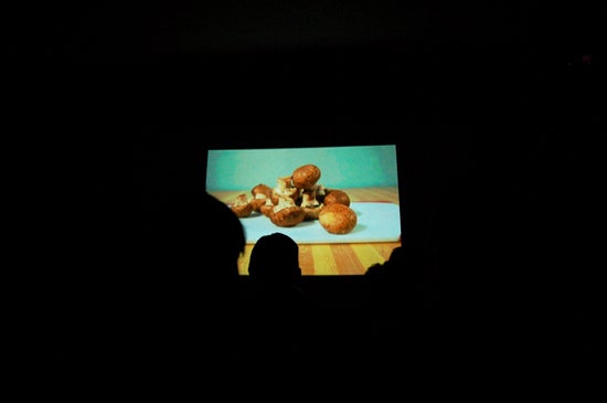 Movie screen showing mushrooms in front of a green screen