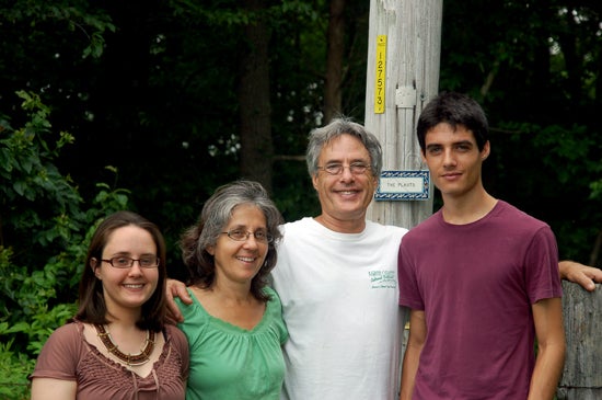 The author poses with her family of four