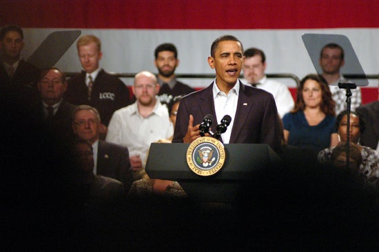 Obama speaks to the crowd from the podium 