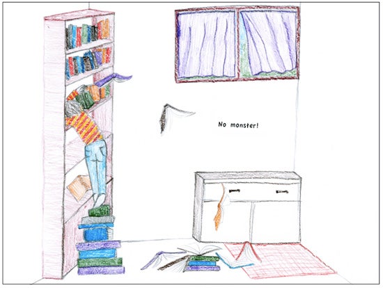 A boy searches through a book shelf