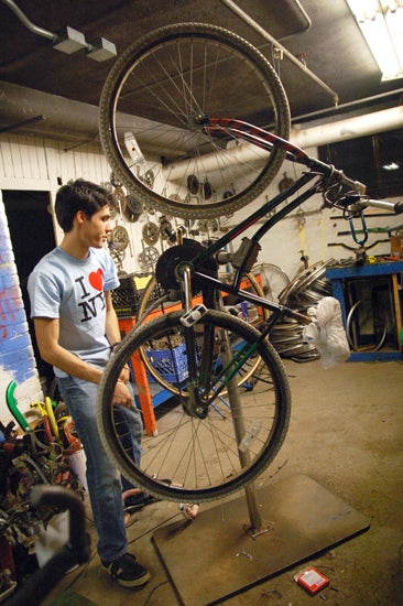 A student repairs a bike