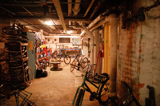 A basement filled with bikes and bike tires 