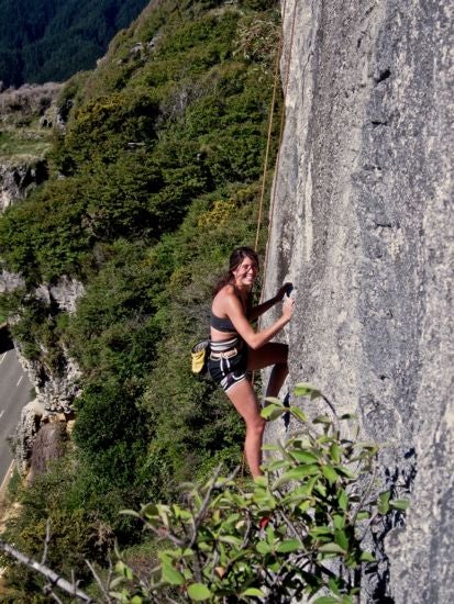 A climber rock climbing on a mountain
