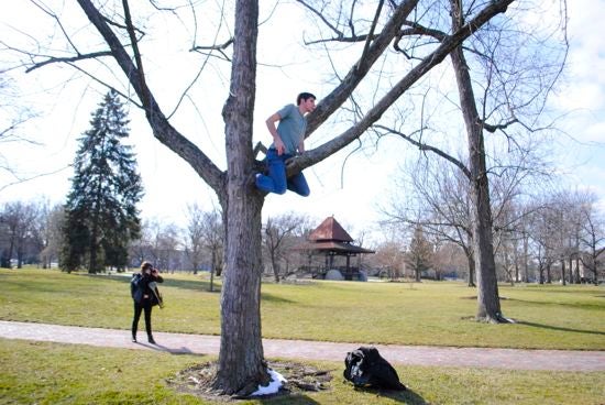 A student climbs a tree
