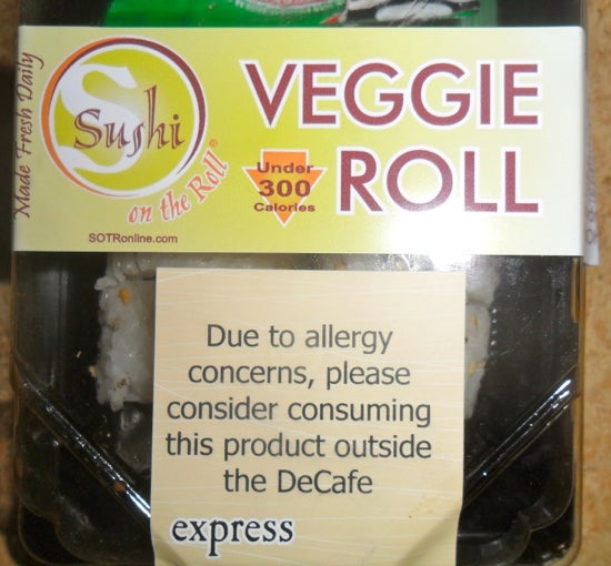 "Due to allergy concerns, please consider consuming this product outside the DeCafe" sign 