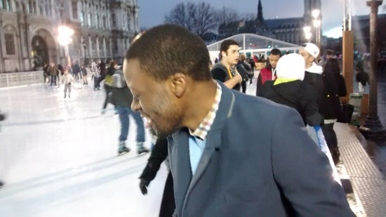 Author in the middle of an ice rink full of people