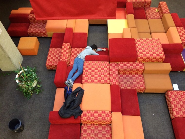 Chul is sprawled out on the connector couches on the second floor of Mudd
