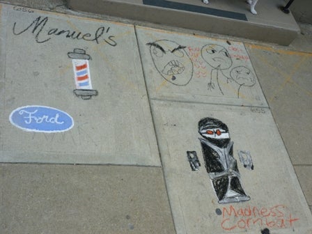 Chalk drawings on sidewalk squares