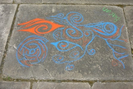 Chalk drawing on a sidewalk square