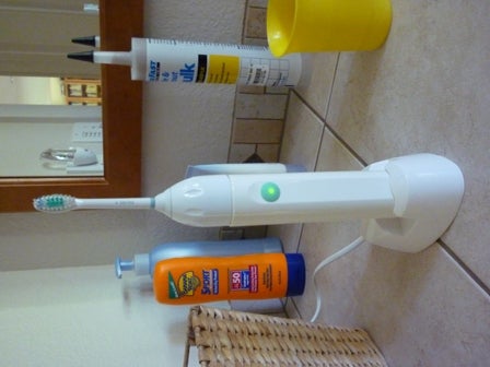 Electric toothbrush on a charging stand