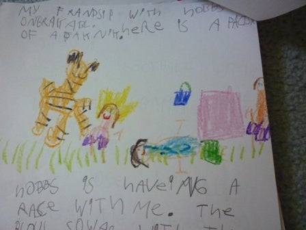 A child's drawing of a tiger and people followed by a child's handwriting