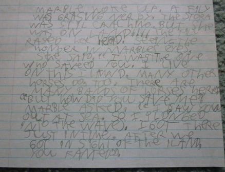 Notebook paper filled with a child's handwriting