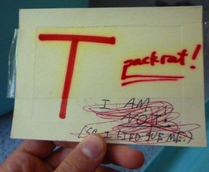 A label with the words "T" and "packrat!"