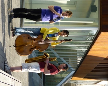 Jazz students playing a melodica, bass, and a saxophone