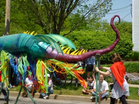 Close-up view of the dragon's tail with small wings and scales.