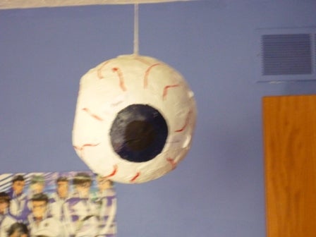 Paper-mache eye ball dangling from the ceiling 
