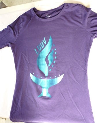 An LUUV logo on a purple t-shirt 