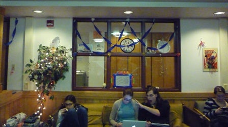 People sitting in the decorated lounge.