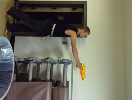 A student shoots a nerf gun