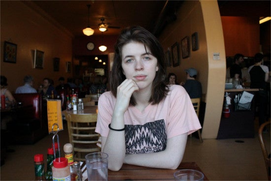 Student sitting at a table in a restaurant 