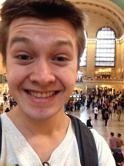 The photographer takes a selfie in a train station