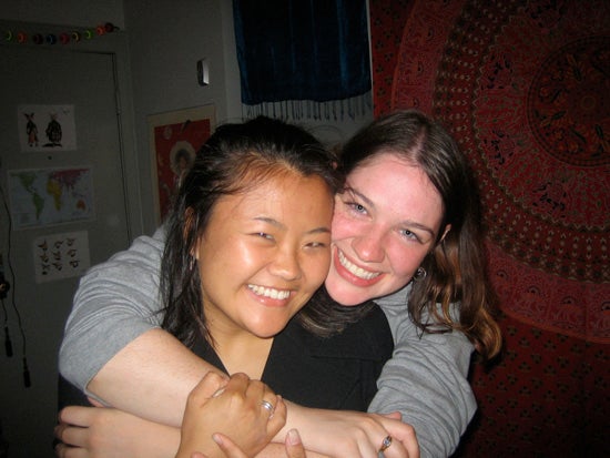 The author with her arms around the shoulders of her friend. Both are smiling for the camera