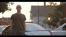 A gif of two people speaking in a parking lot. The animated words "no great story comes without difficulty" appear 