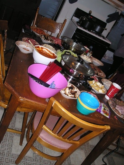 More plates and bowls full of food.