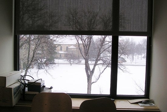 A window overlooking a snowy Finney Chapel 