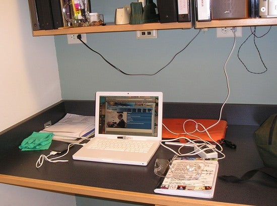 A laptop sits at a desk