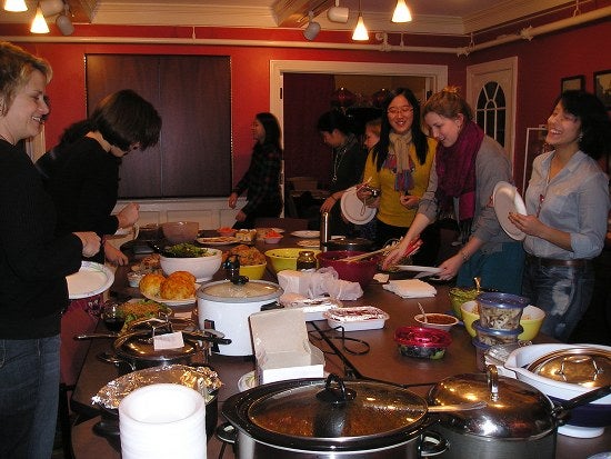 A table full of potluck food