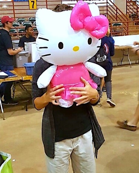 8th grade me holding large, inflatable Hello Kitty over my face because I hated pictures. 