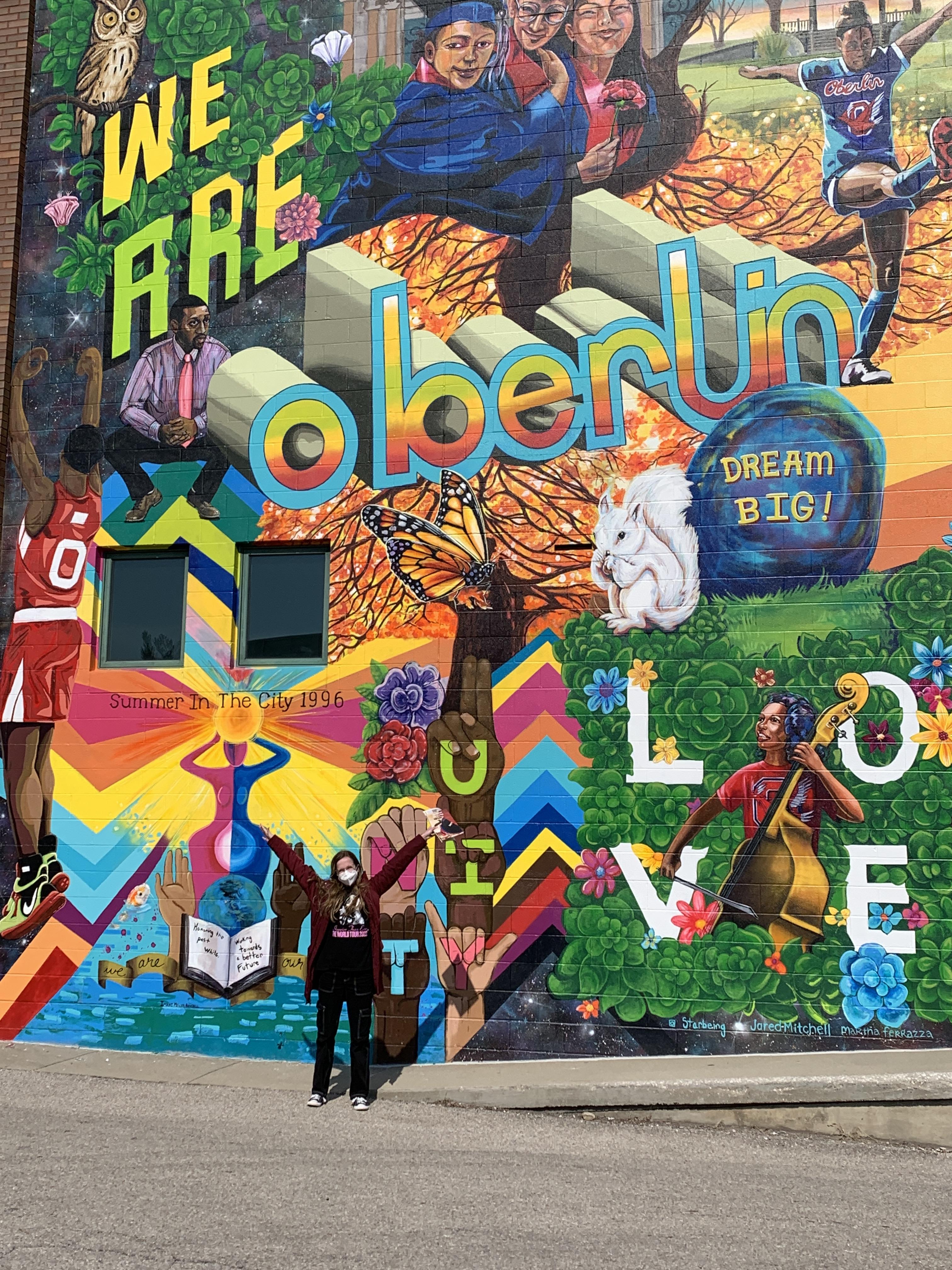 Me in front of the Oberlin mural during my first tour.
