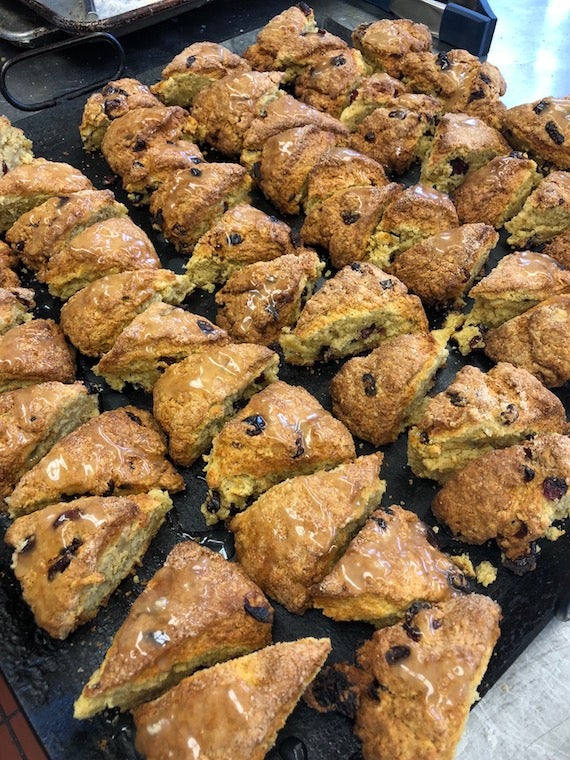 A pan filled with many rows of ready to eat scones