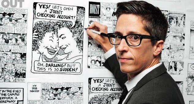Alison Bechdel holding up a pen to a wall covered in images from her novels.