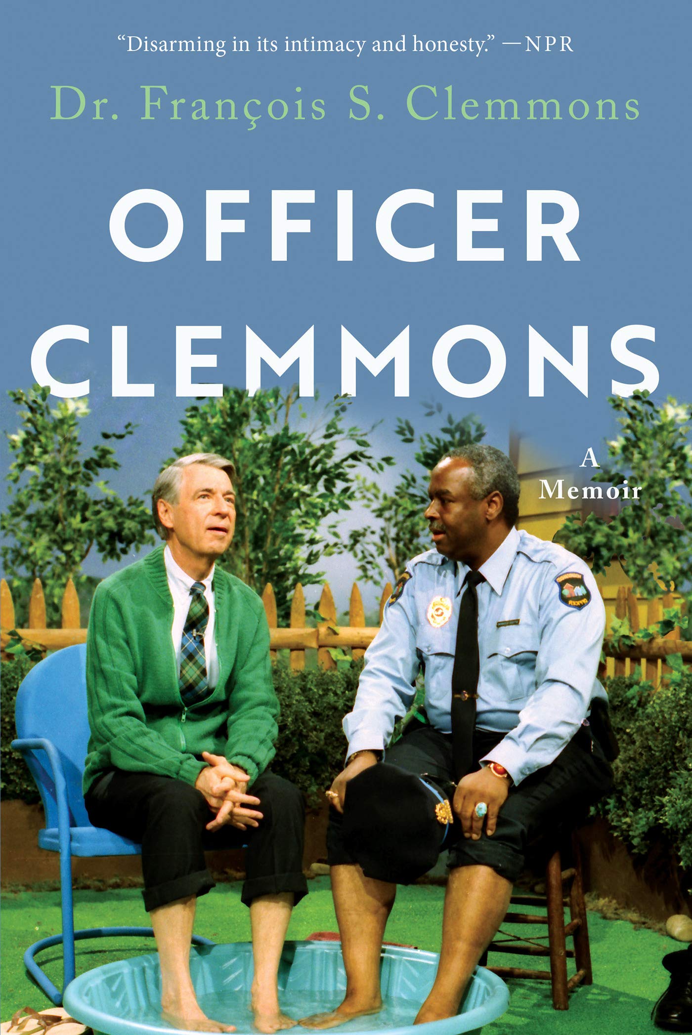 A book cover featuring a picture of Mr. Rogers and Dr. Clemmons sitting together with they feet in a small pool. Text reads: "Disarming in its intimacy and honesty." NPR. Dr. François S. Clemmons, Officer Clemmons a Memoir