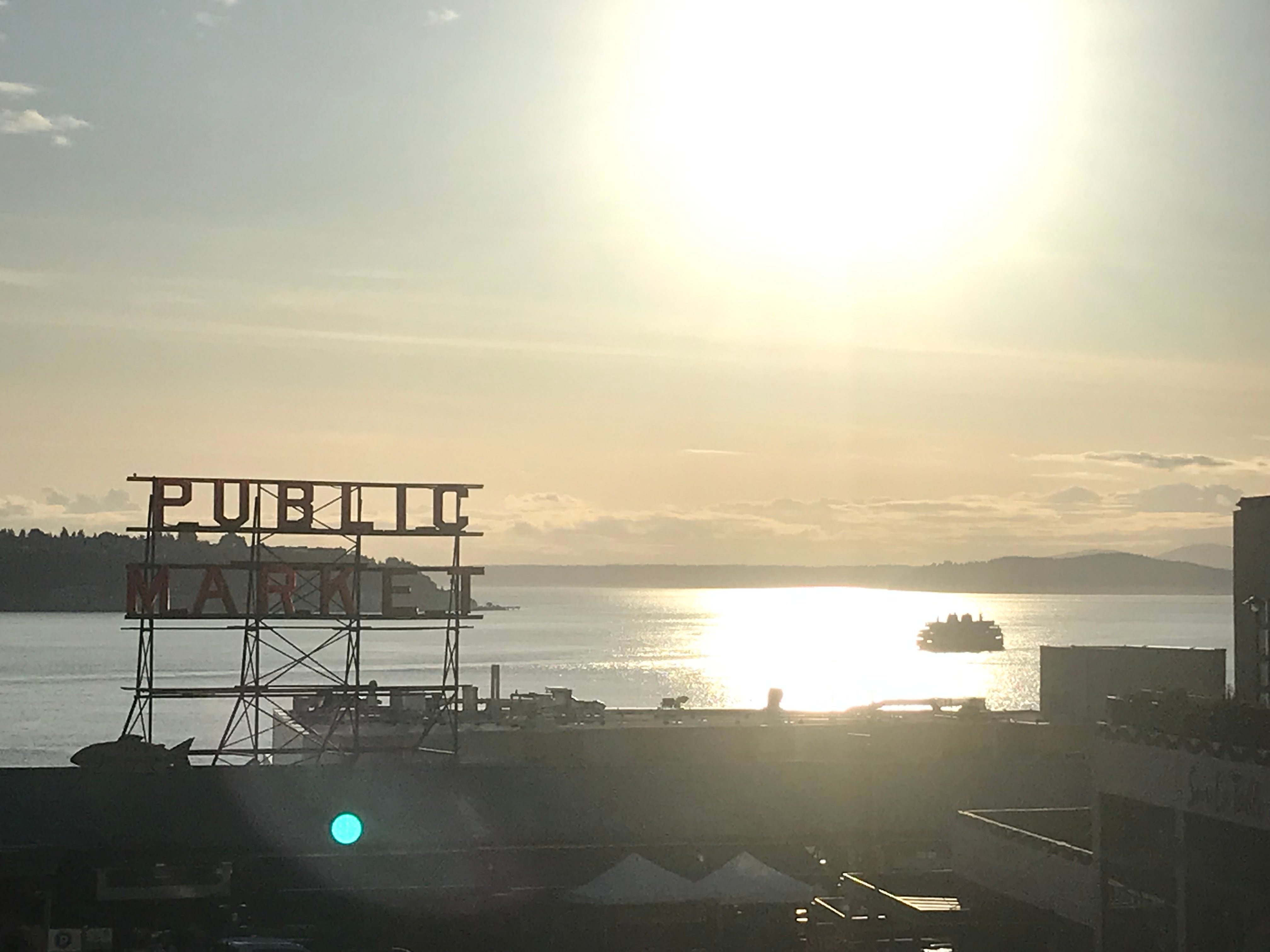 Pike Place Public Market sign at sunset.
