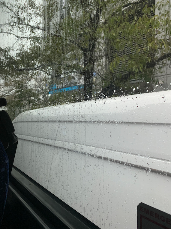 a rainy bus window.
