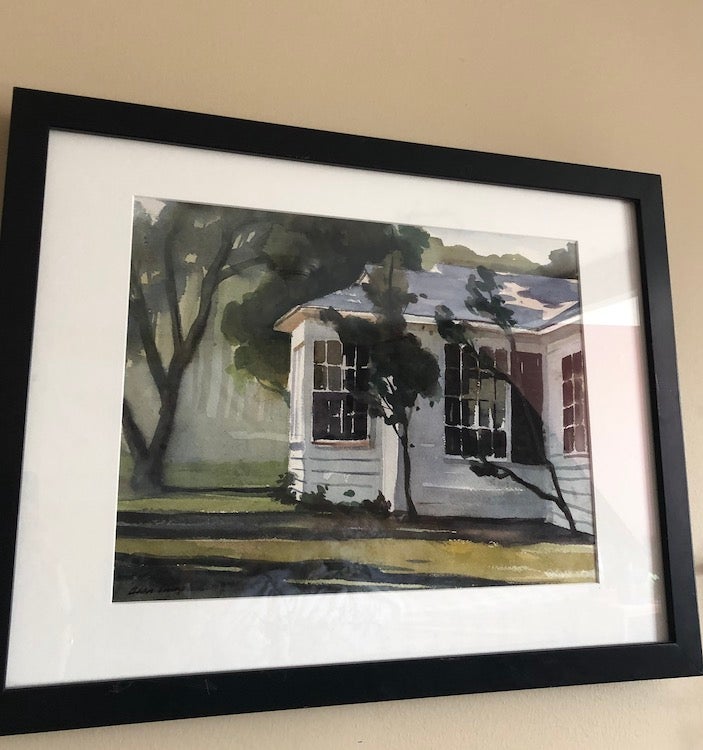 A photo of Alan Campbell's "Morning Light - Ossabaw" which is a painting of a white house bathed in light.