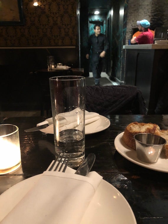 A restaurant view of plates and drinks on a table.