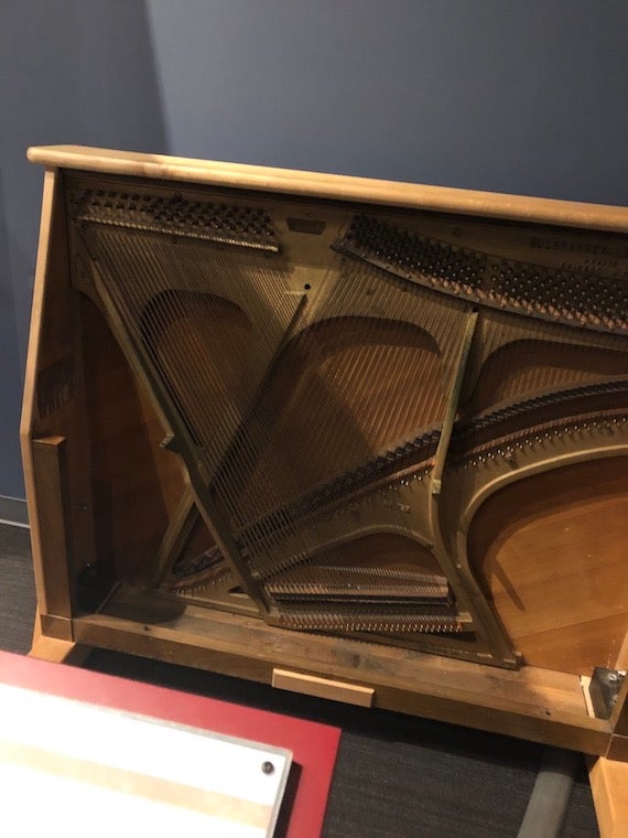 A hands-on exhibit featuring the inside of a piano.
