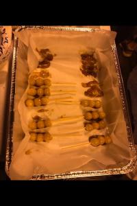 Here is a photo of the dango, which we made from scratch. They are covered in a sweet soy sauce glaze — delicious!